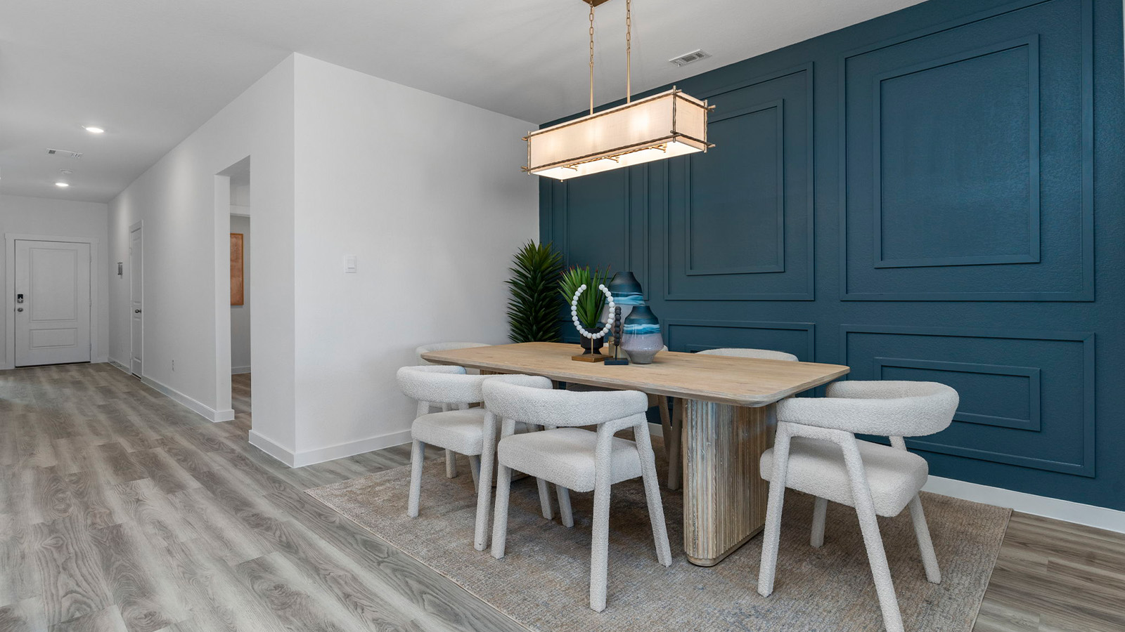 Spacious open concept dining area with vinyl wood flooring and access to the living and kitchen areas