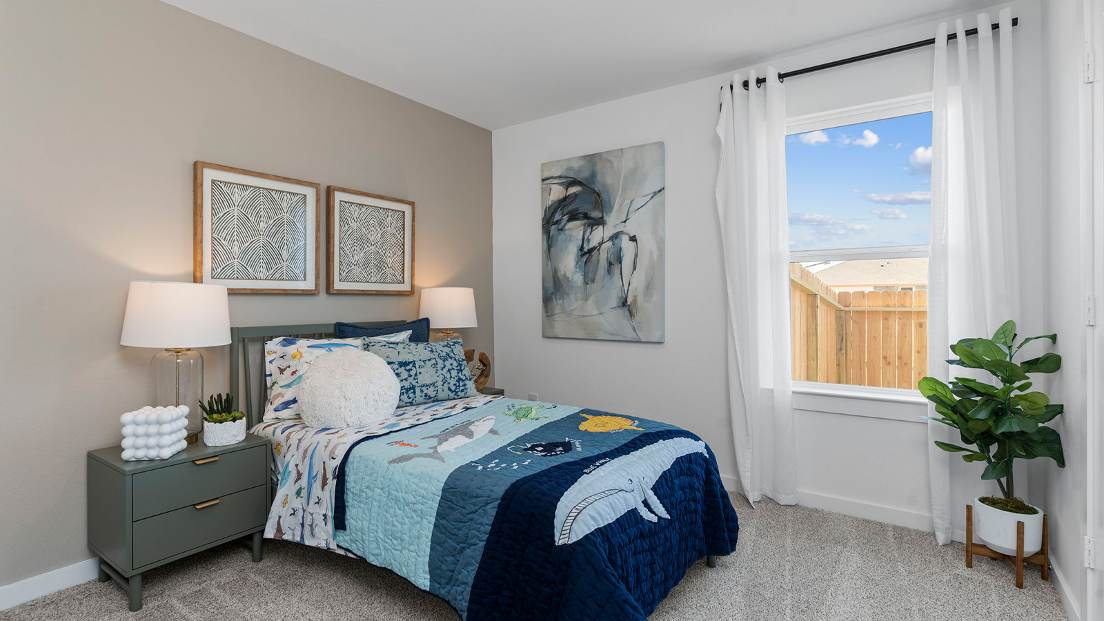 Comfortable guest bedroom featuring neutral-toned walls, carpeted flooring, and a separate closet.