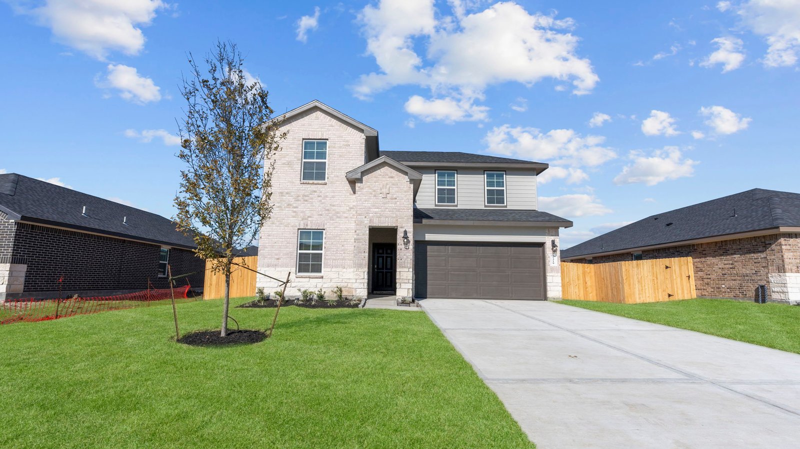 two story home with a two car garage