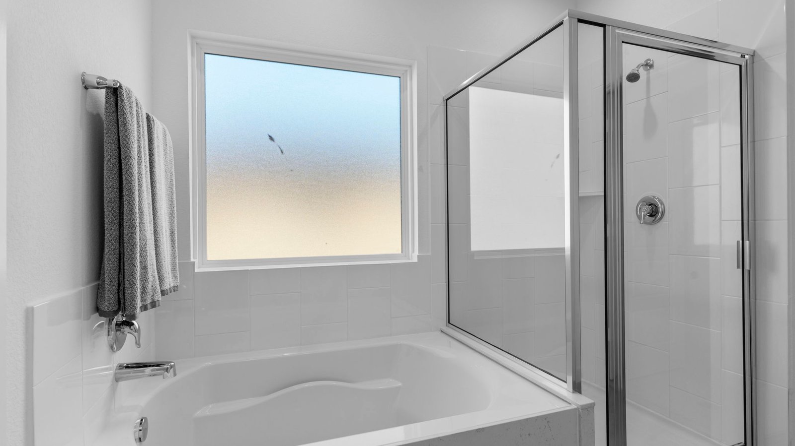primary bathroom with tub and shower