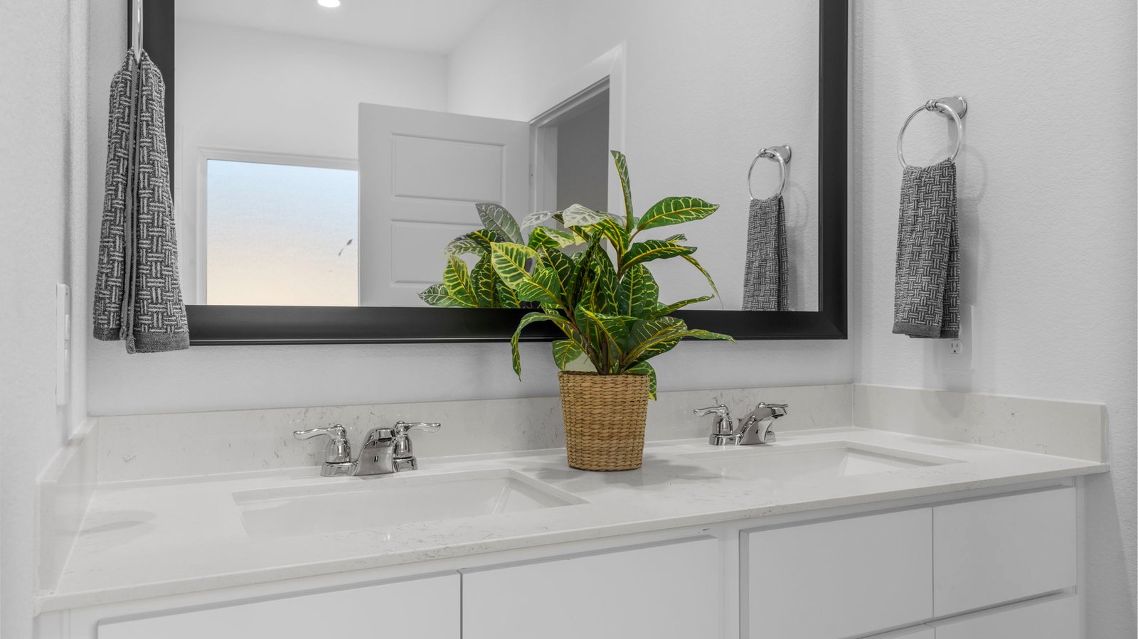 primary bathroom vanity with two sinks