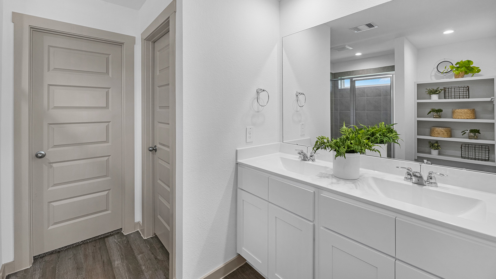 primary bathroom vanity with two sinks