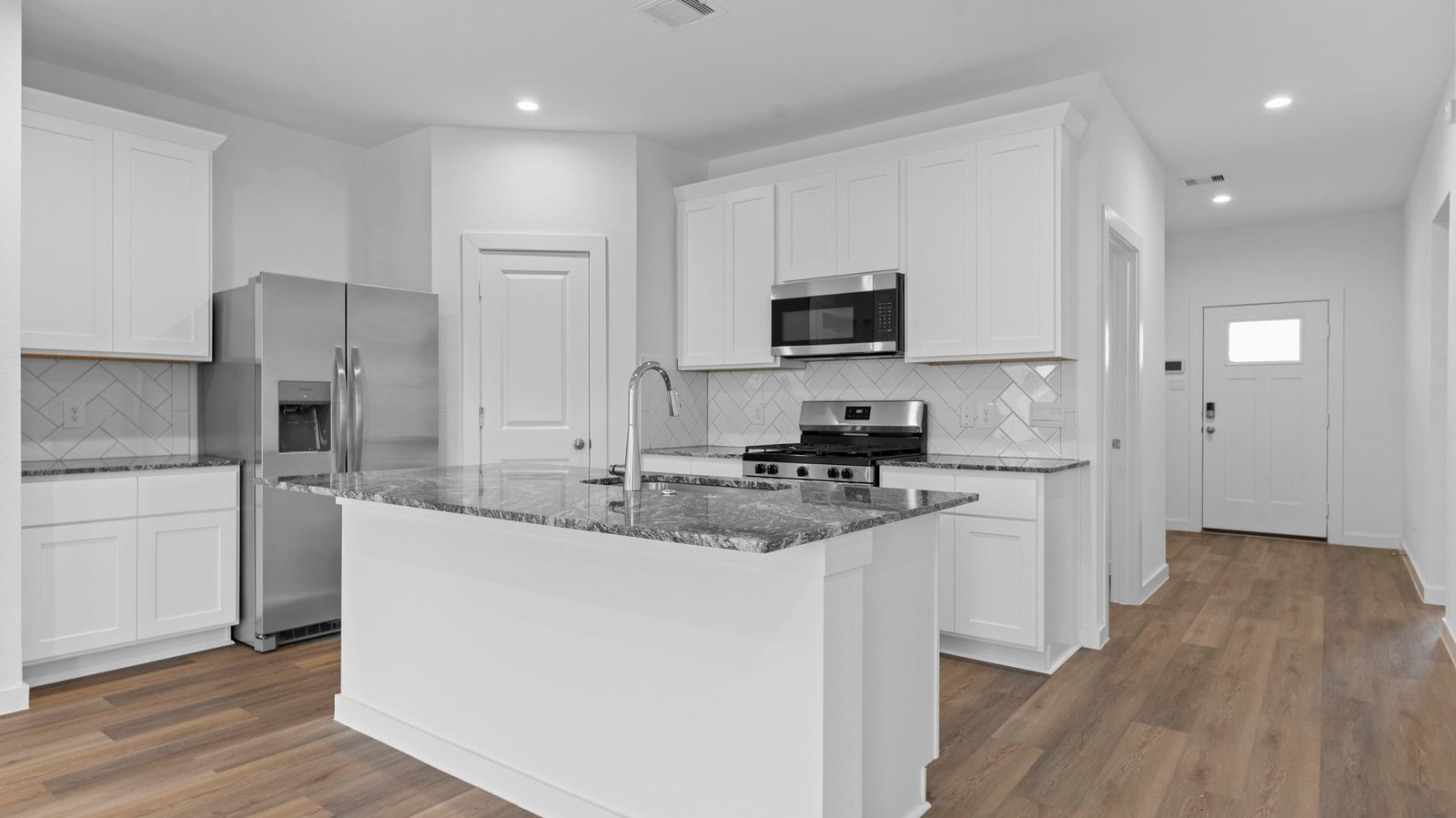 kitchen with large island with walk in pantry