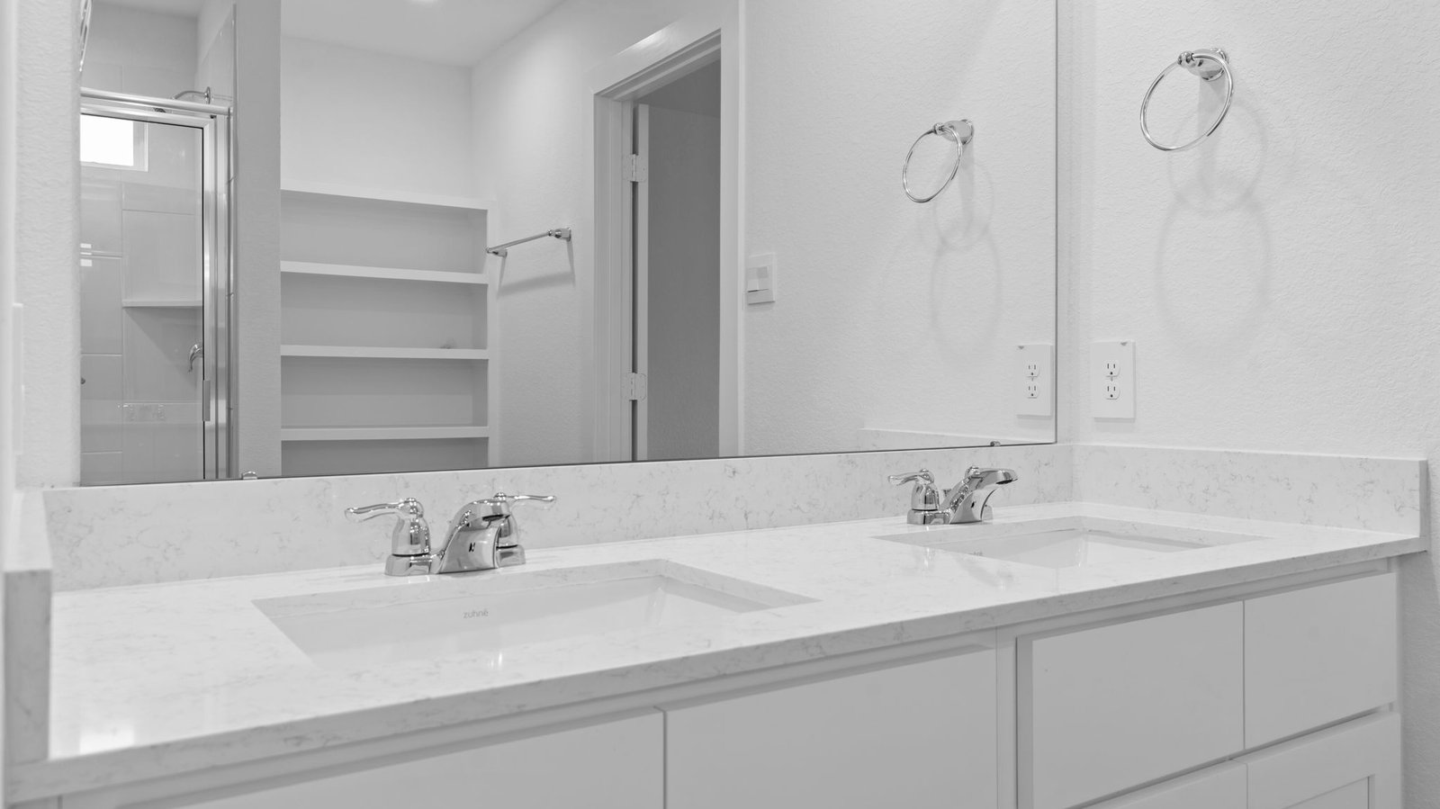 primary bathroom vanity with two sinks