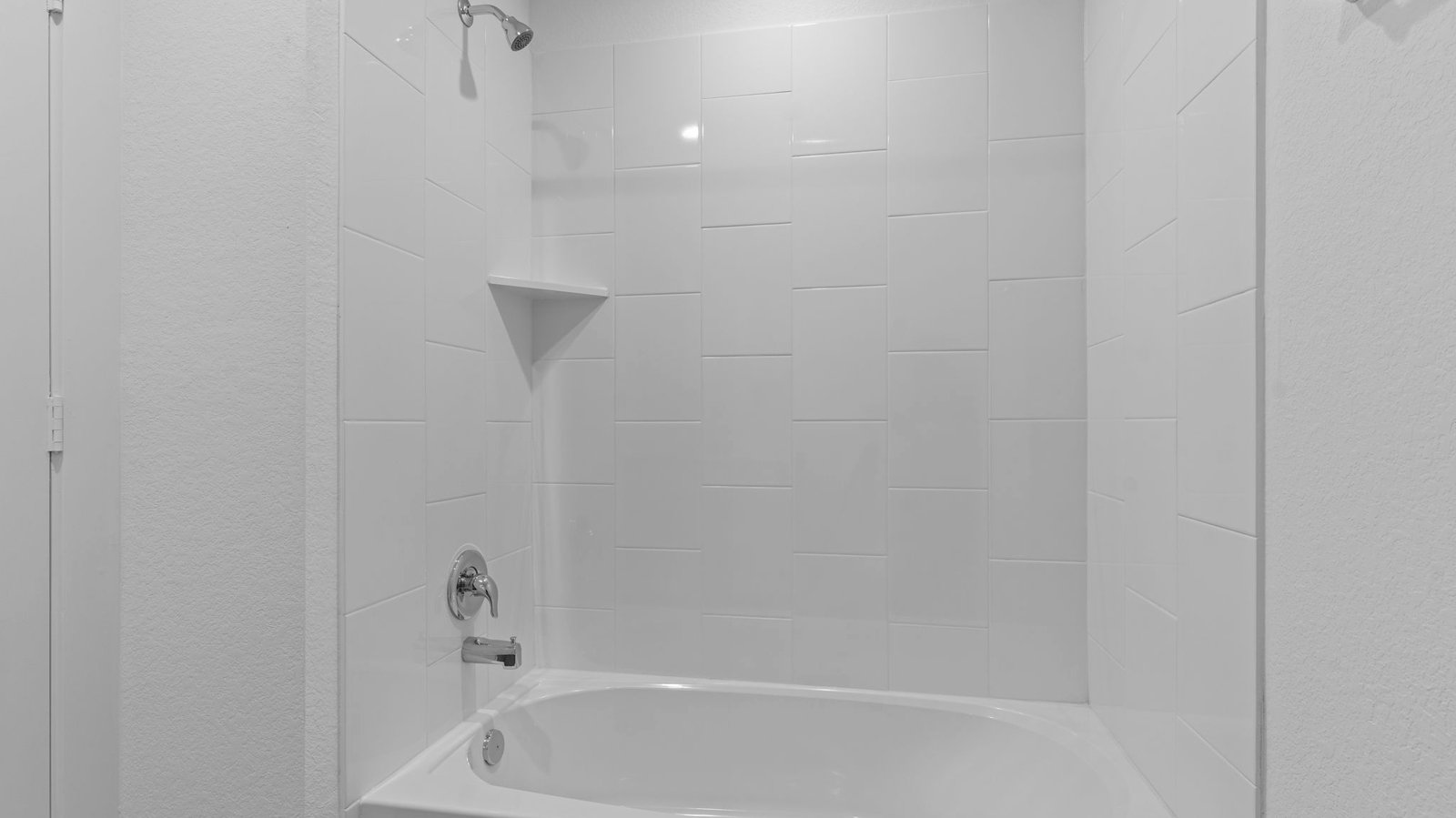 secondary bathroom with tub and shower
