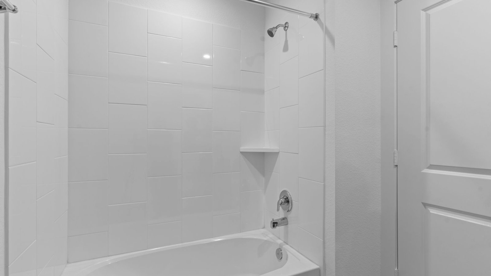 A well-designed bathroom equipped with quartz countertops, a standing tub, and a single vanity.
