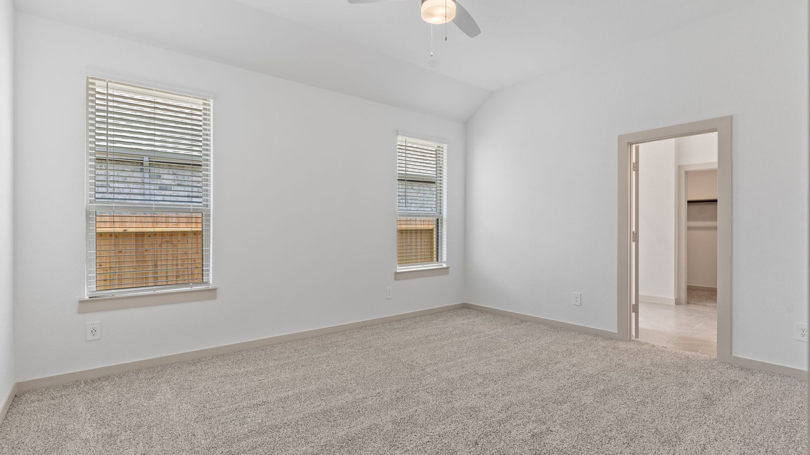 primary bedroom with two windows