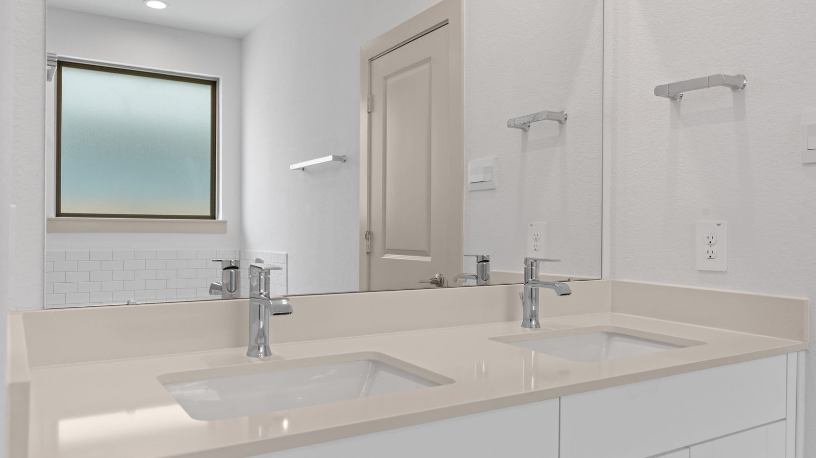 primary bathroom vanity with two sinks