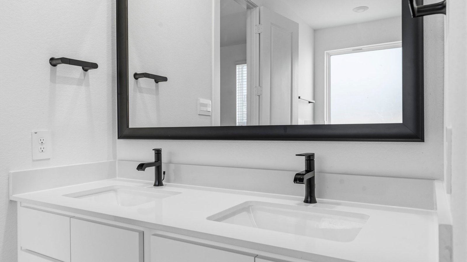 primary bathroom vanity with two sinks
