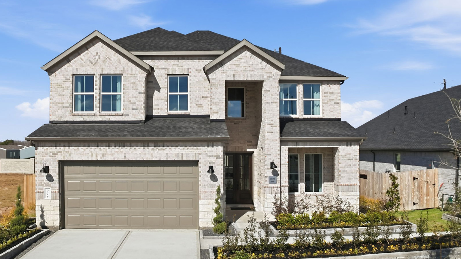 two story home with a two car garage