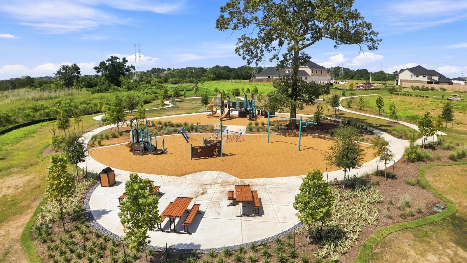 community park with picnic tables and a playground