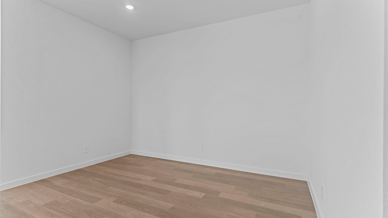 Spacious open concept dining area with vinyl wood flooring and access to the living and kitchen areas