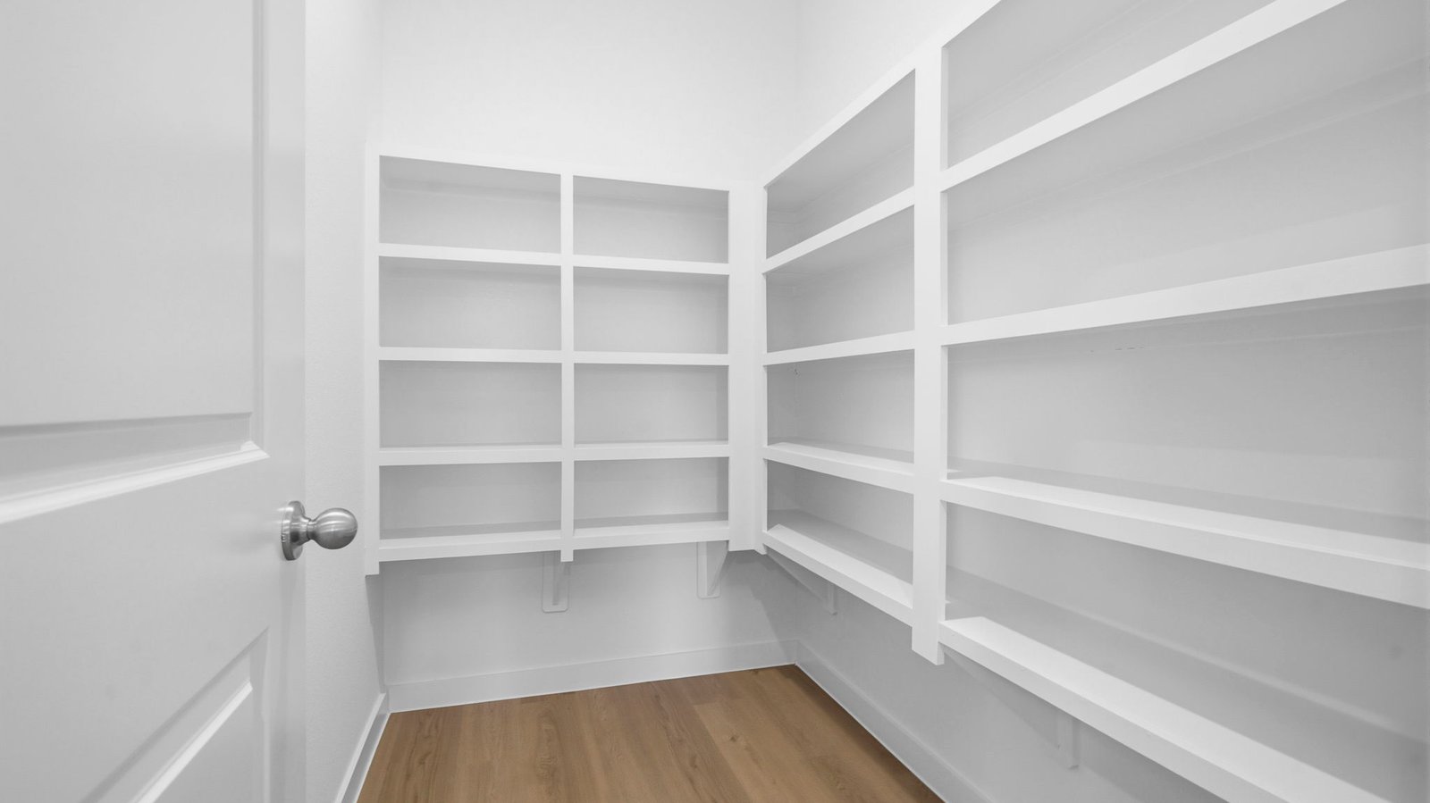 Walk-in pantry off the kitchen with built in shelves for maximum storage