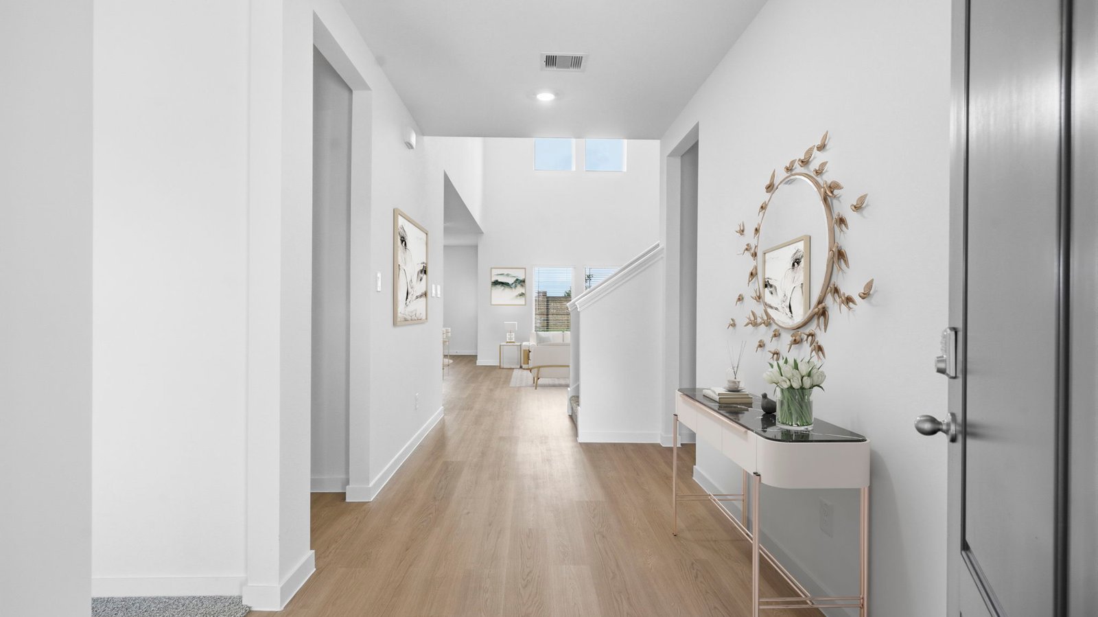 Entry hallway leading to living room and kitchen in the background.