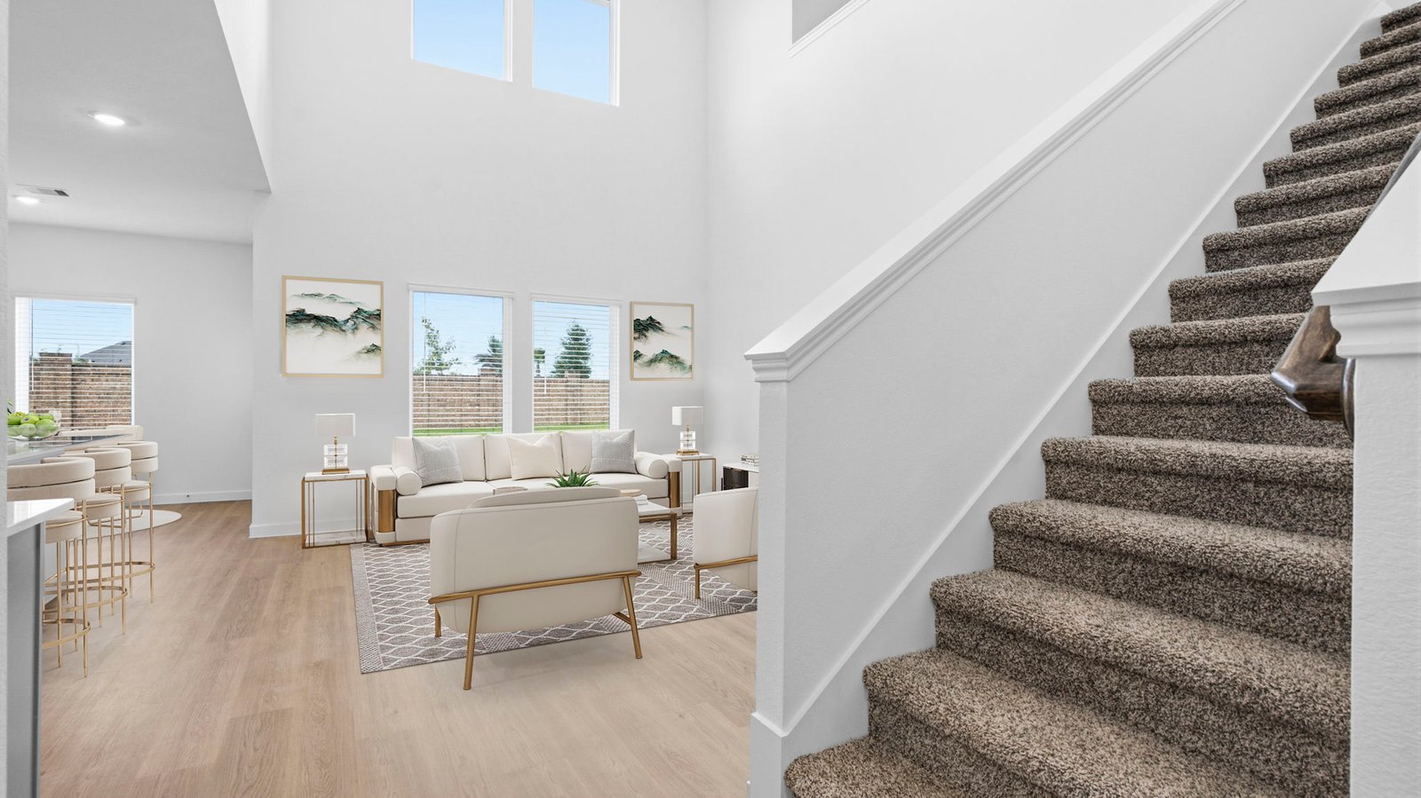 Spacious entry foyer with grand staircase leading to the second floor