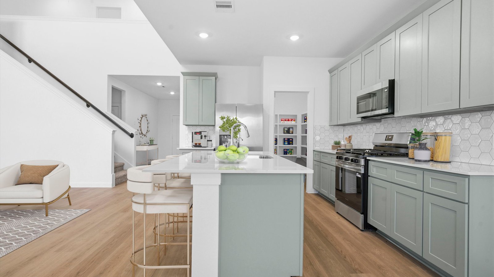 Kitchen adorned with painted cabinets seamlessly integrated into an open dining area layout.