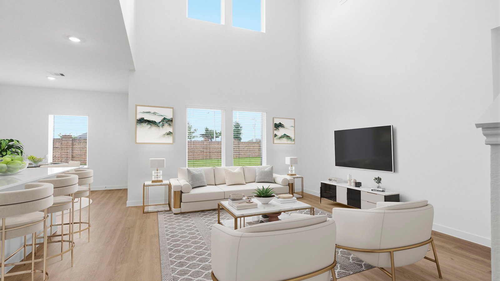 A well-organized living room that includes a kitchen and dining area, creating a warm and welcoming environment for gatherings.