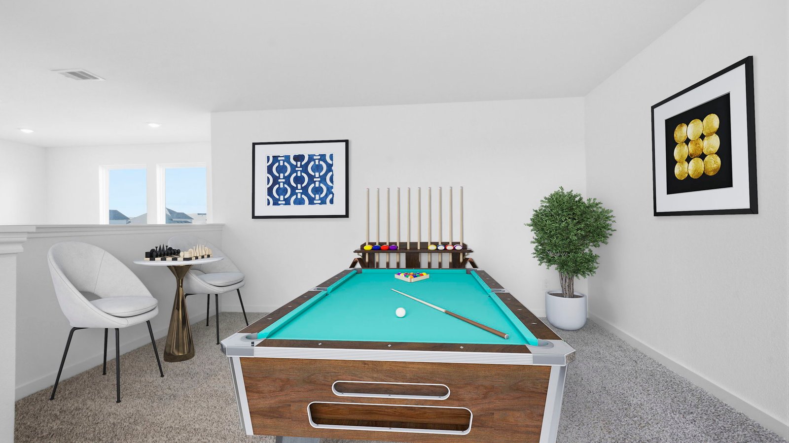 A spacious upstairs living area with plenty of natural light from windows overlooking side of the home