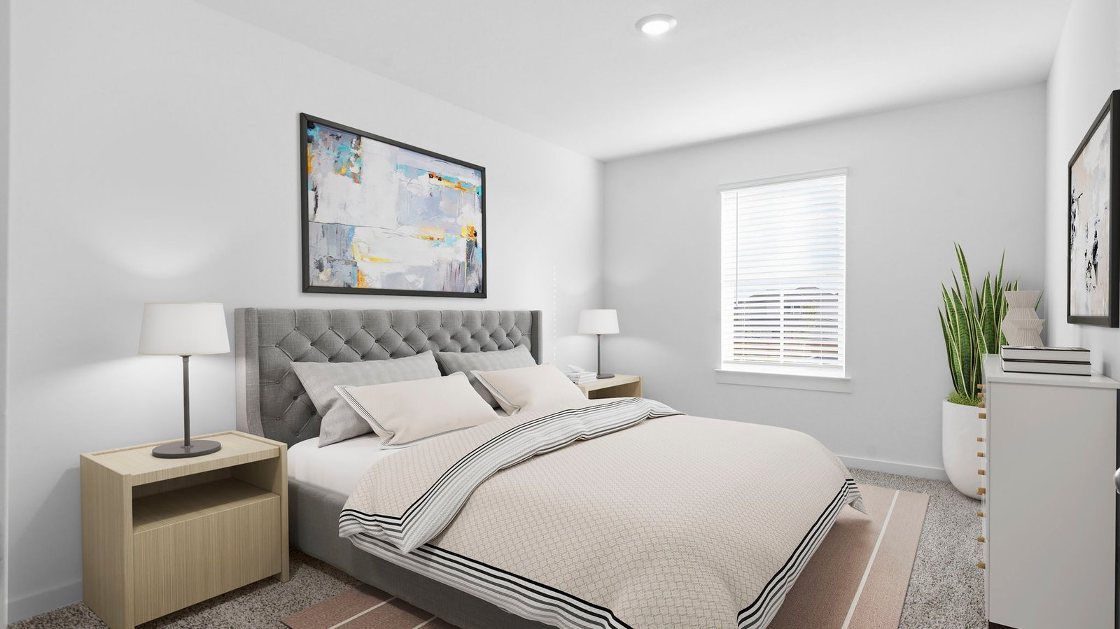 Comfortable guest bedroom featuring neutral-toned walls, carpeted flooring, and a separate closet.