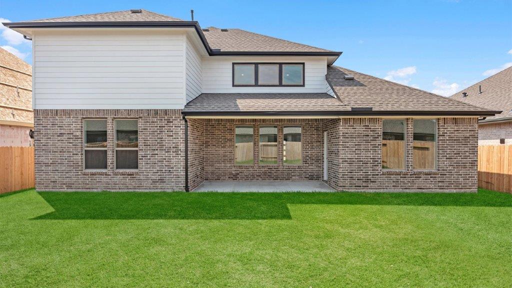 Outdoor covered patio with room for outdoor furniture to enjoy the backyard in those cooler months