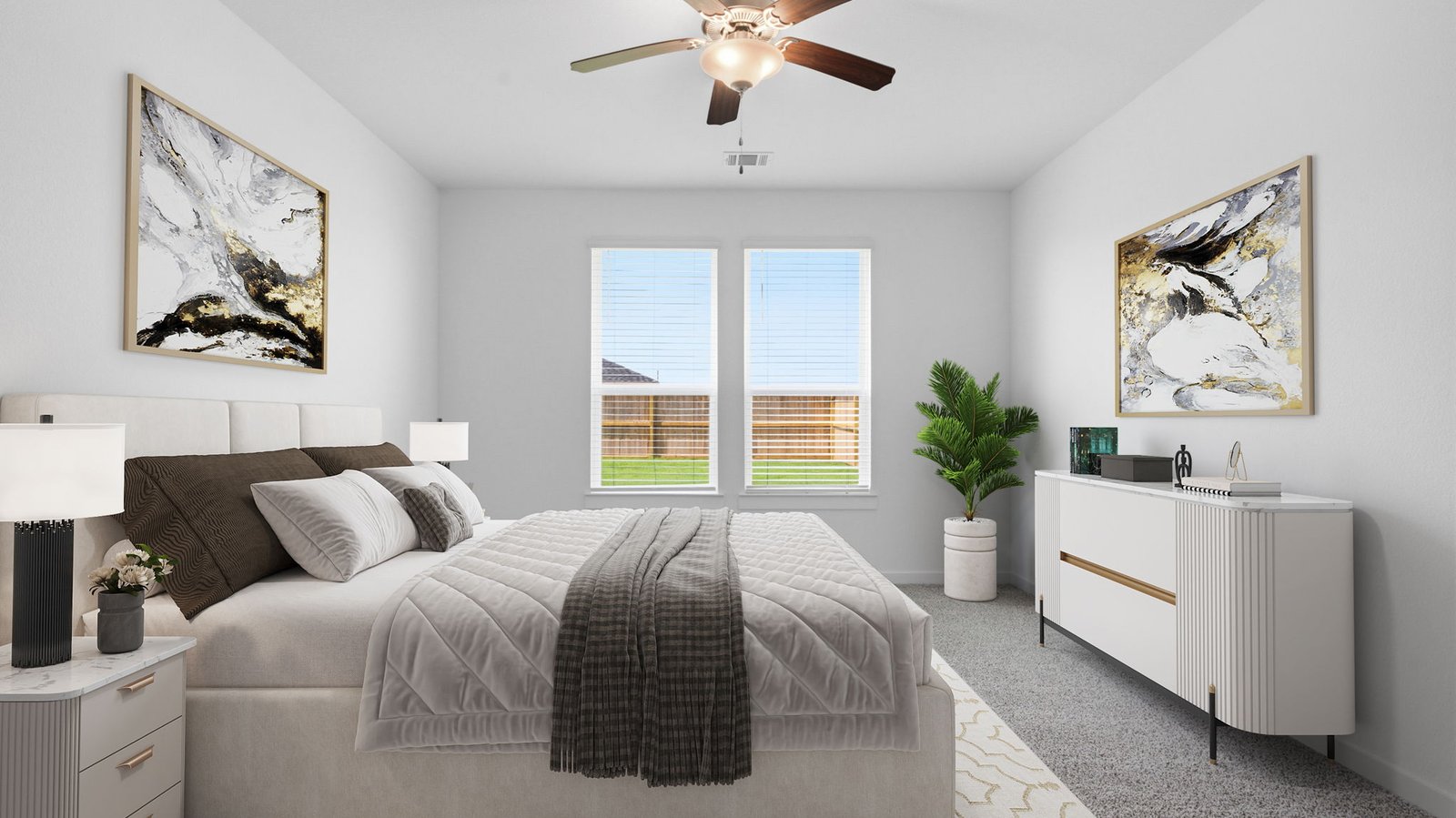 A spacious primary bedroom emphasizing open space and natural lighting with large windows.