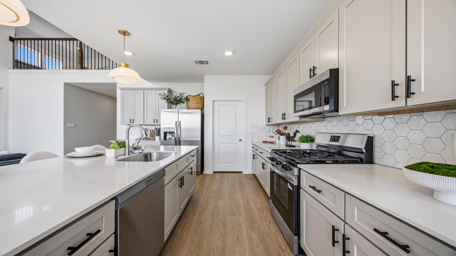 Kitchen adorned with painted cabinets seamlessly integrated into an open dining area layout.