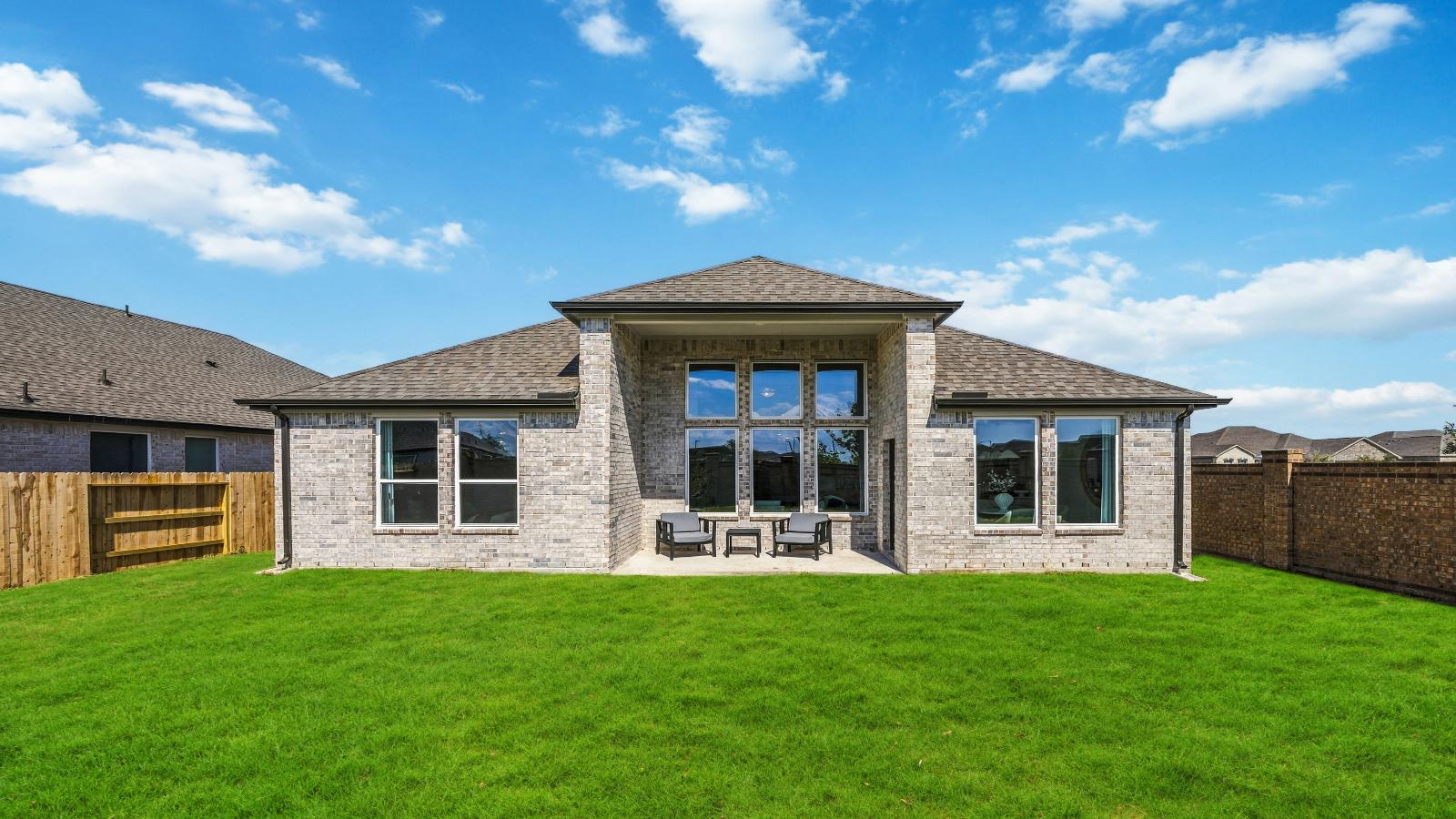 Outdoor covered patio with room for outdoor furniture to enjoy the backyard in those cooler months