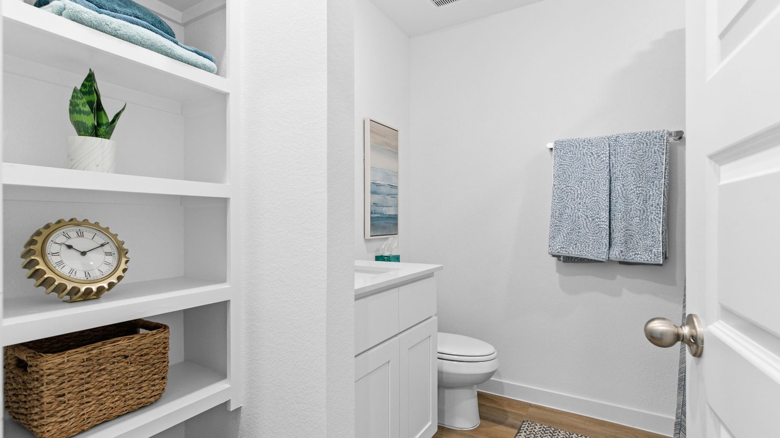 A well-designed bathroom equipped with granite countertops, a standing tub, and a single vanity.