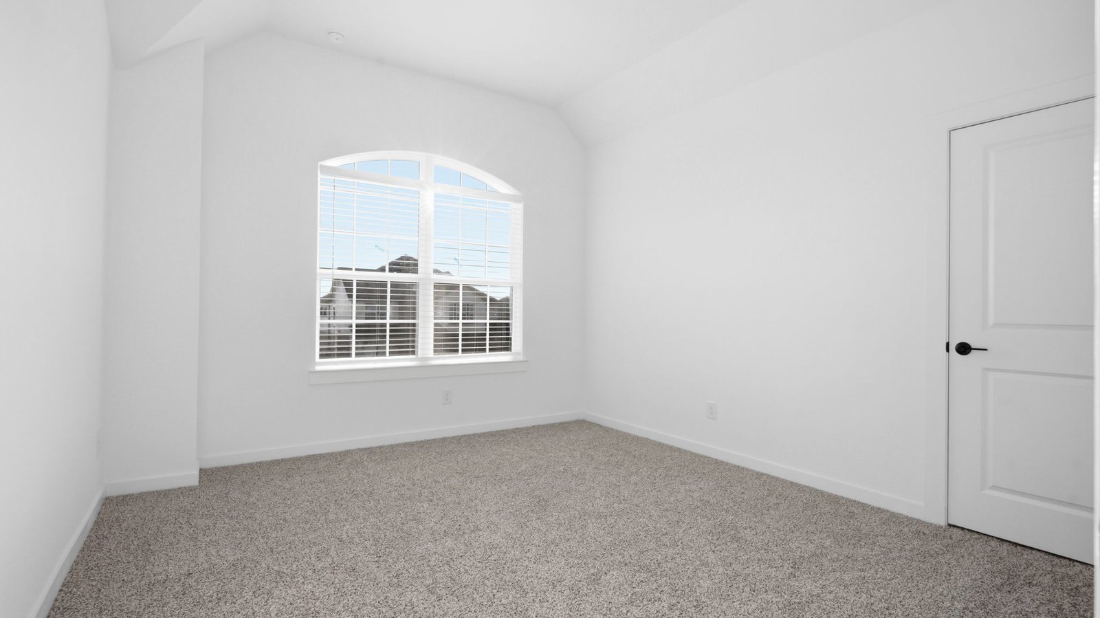 A third bedroom with neutral walls, plush carpet flooring and a separate closet.