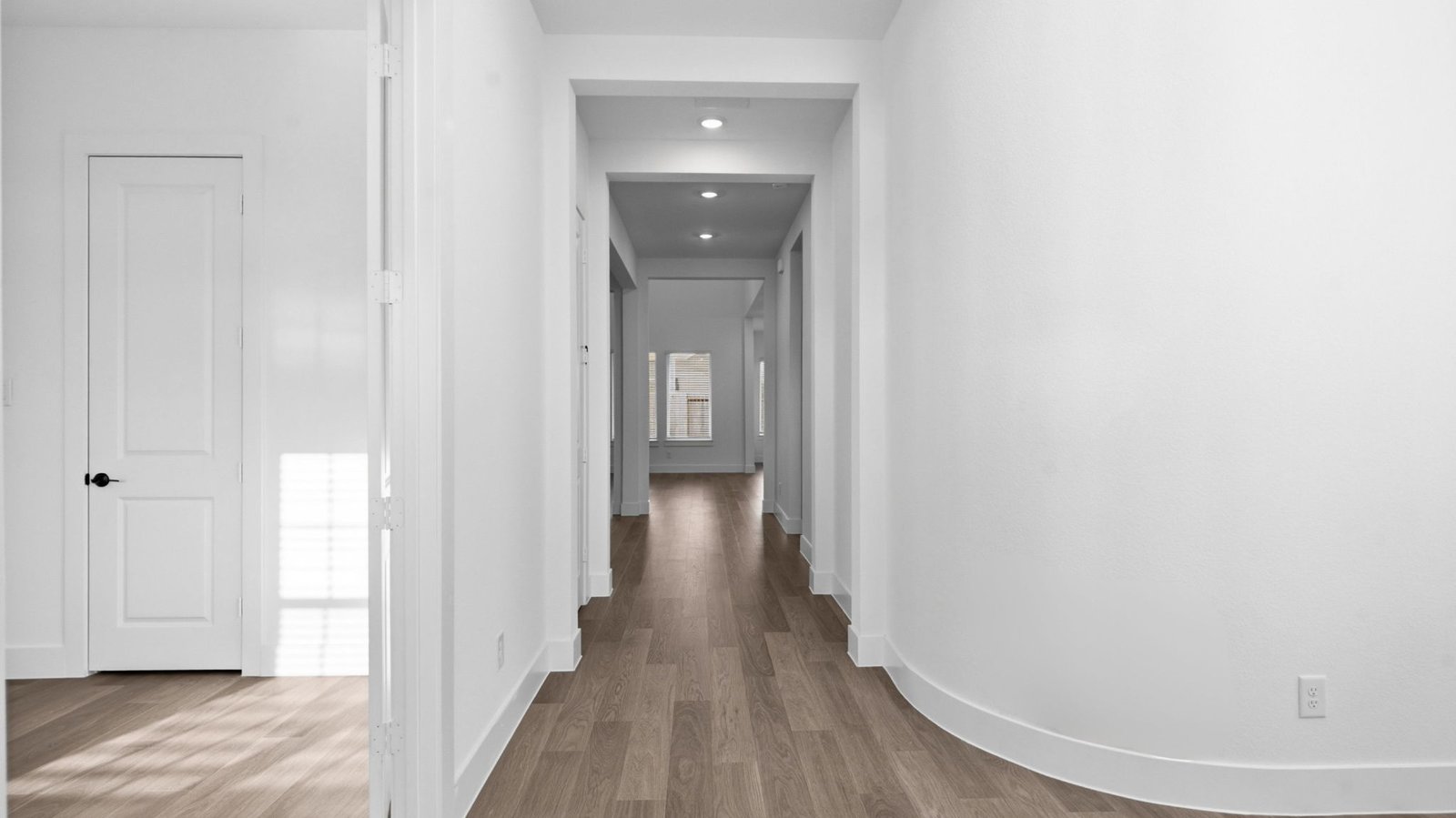 Entry hallway leading to bedrooms in the background.