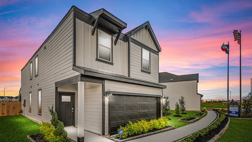 Model Home exterior dusk with sunset