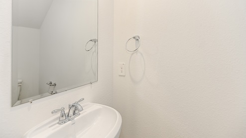 half bath with vanity and commode