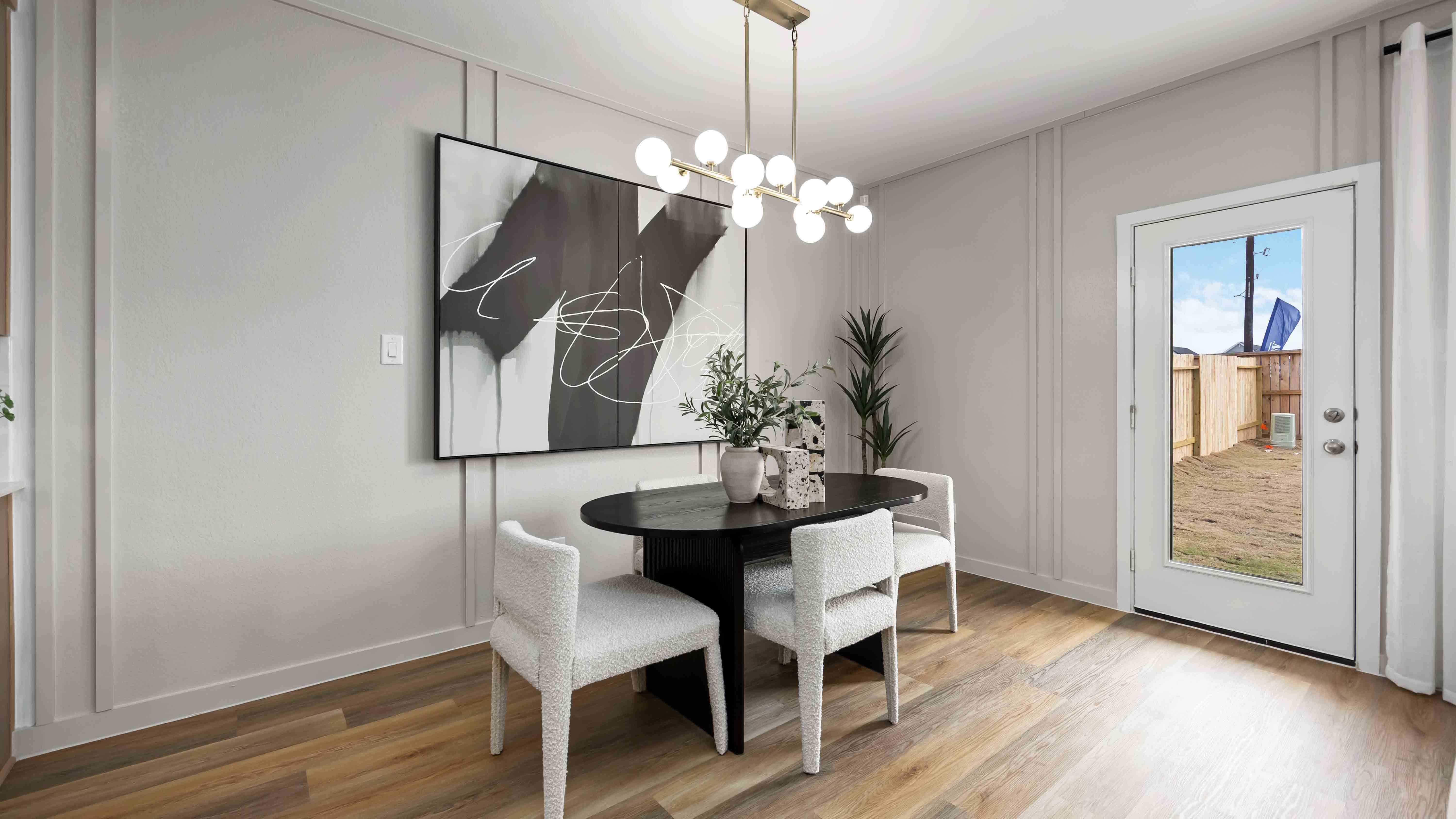 dining area with natural lighting that overlooks the backyard