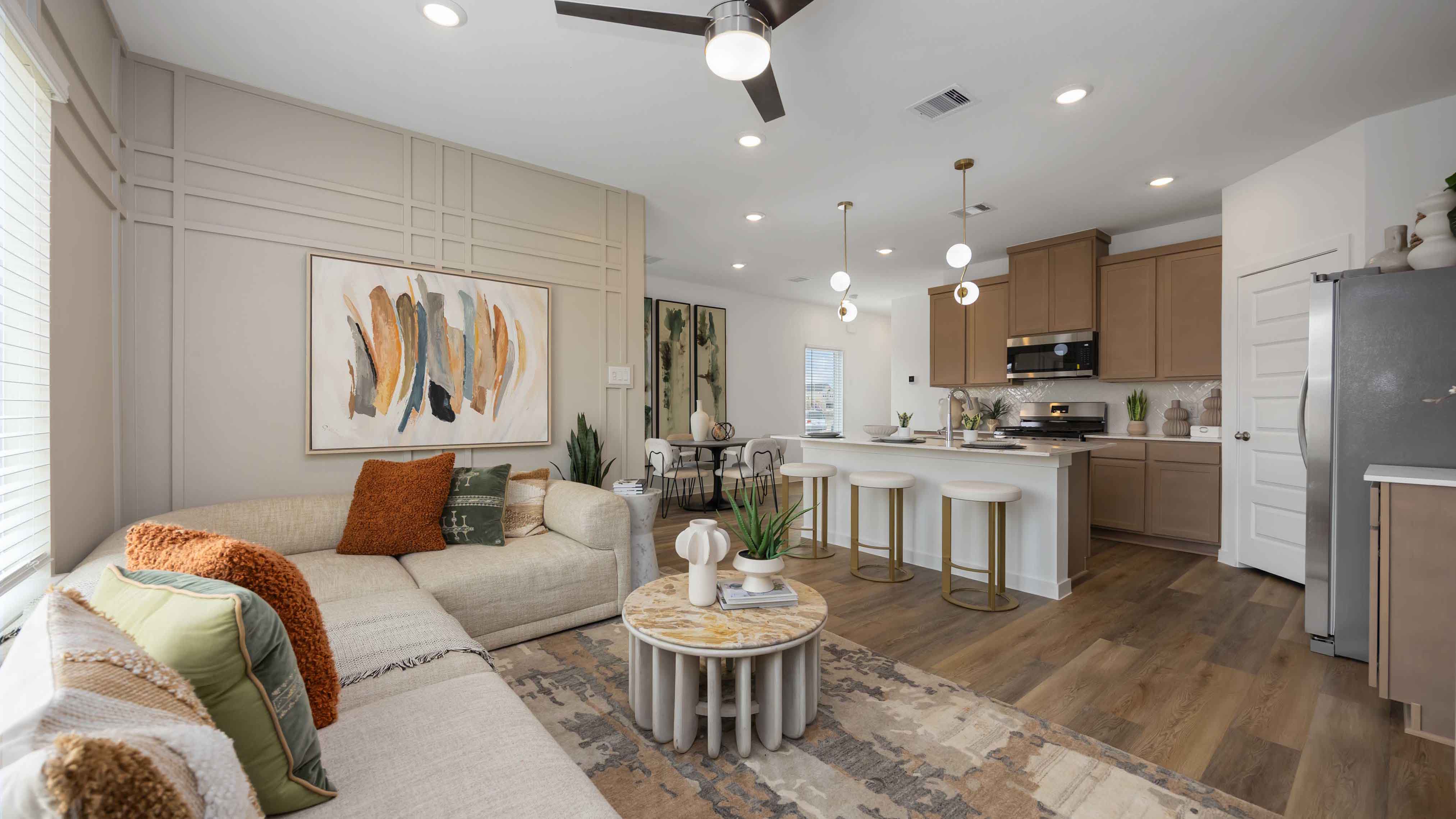 living room area with two large windows to the backyard
