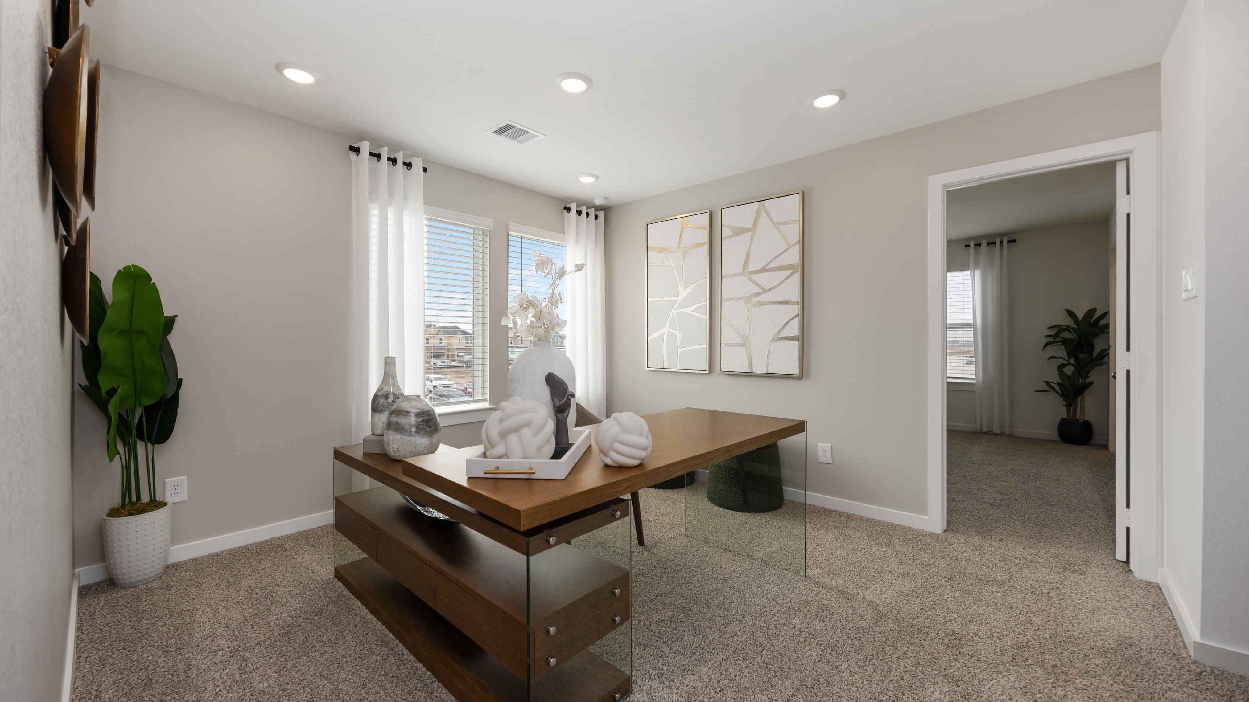 spacious upstairs living area with plenty of natural light from windows overlooking side of the home