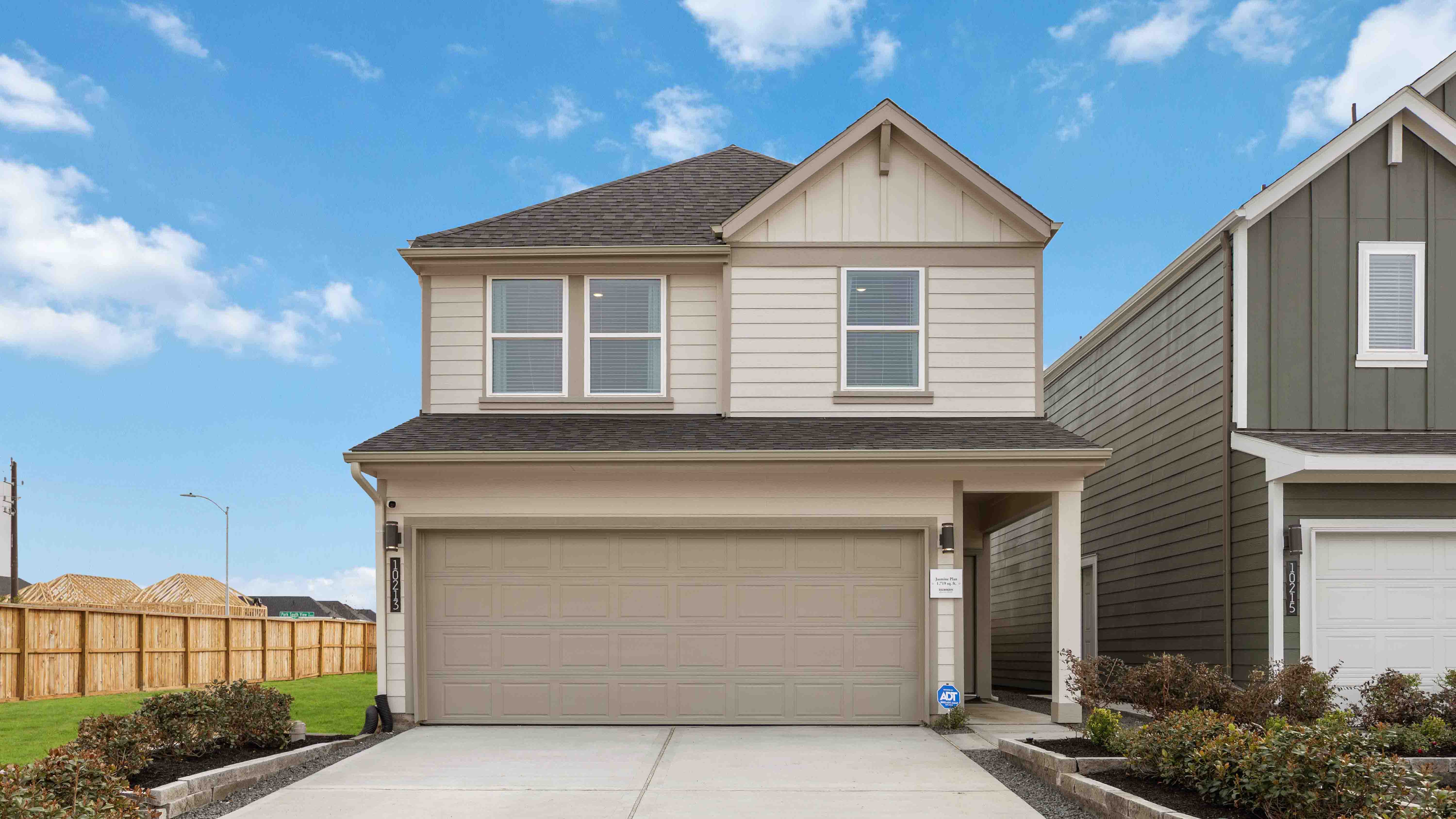 two-story home with siding and a two-car garage