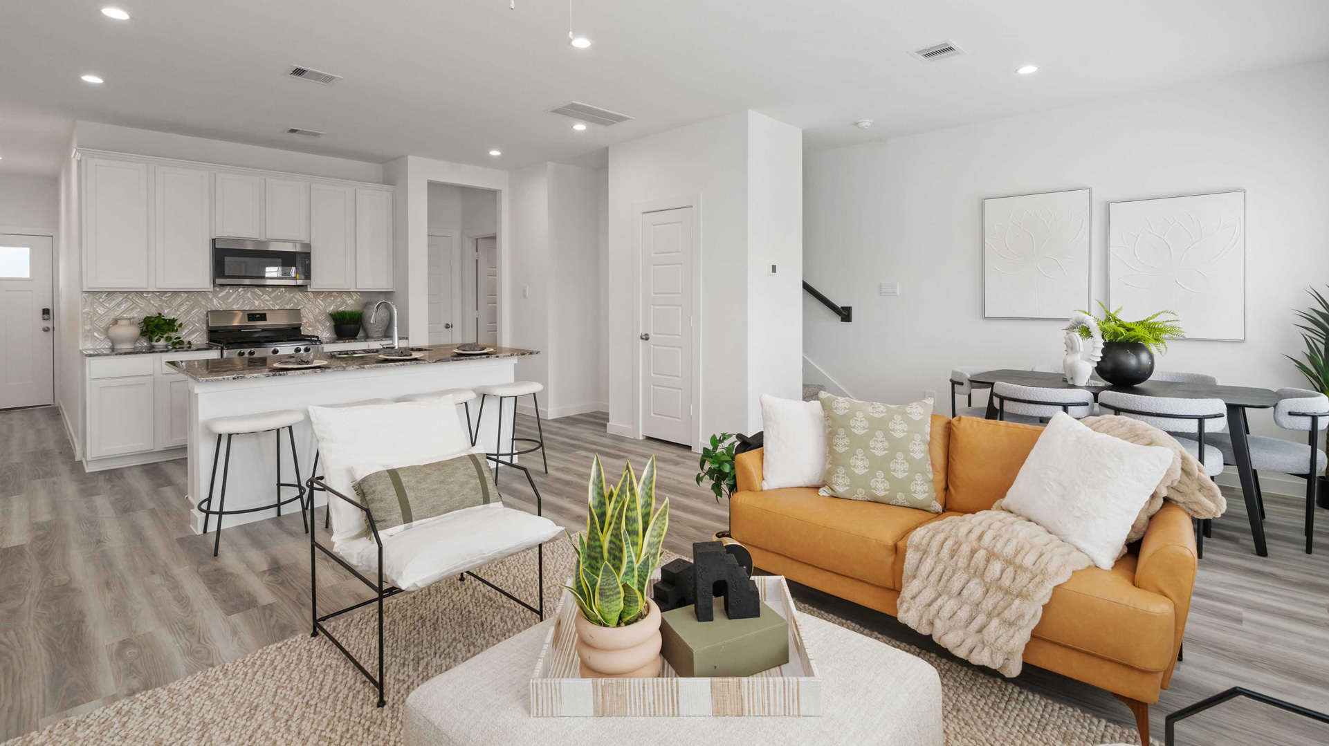 spacious living room with plenty of natural light from windows overlooking the backyard