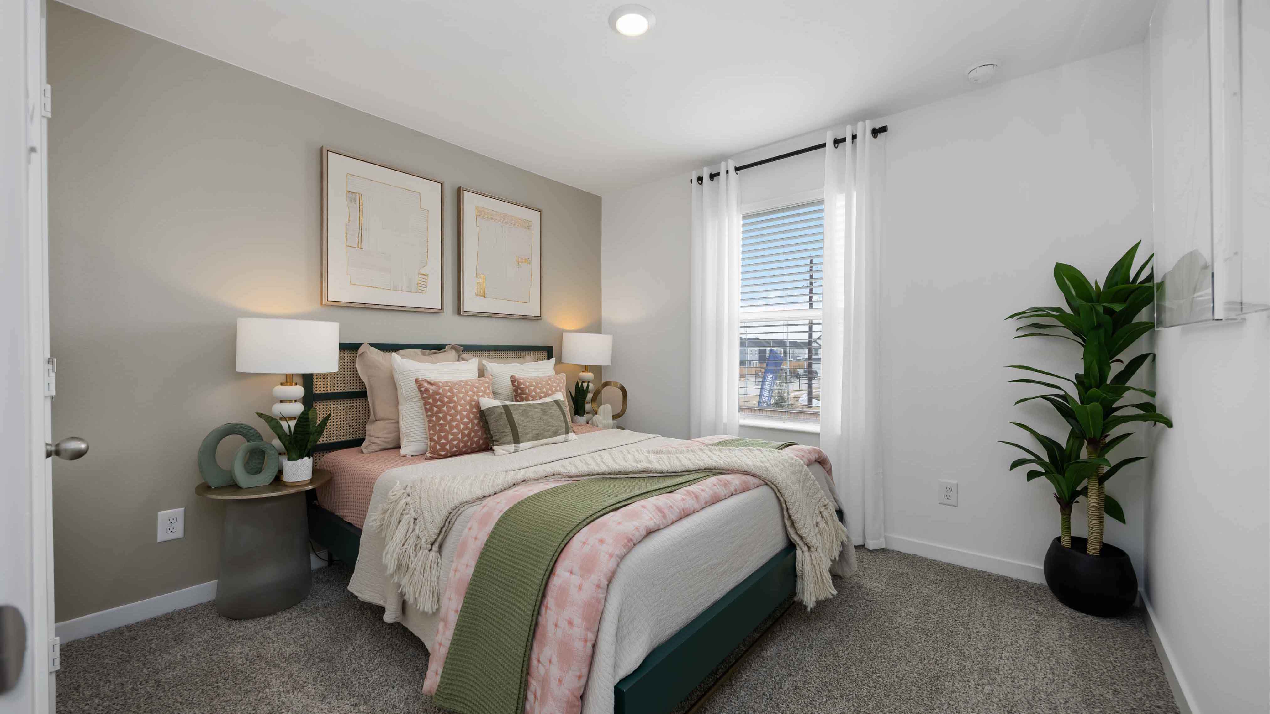 secondary bedrooms have light neutral walls and carpet flooring