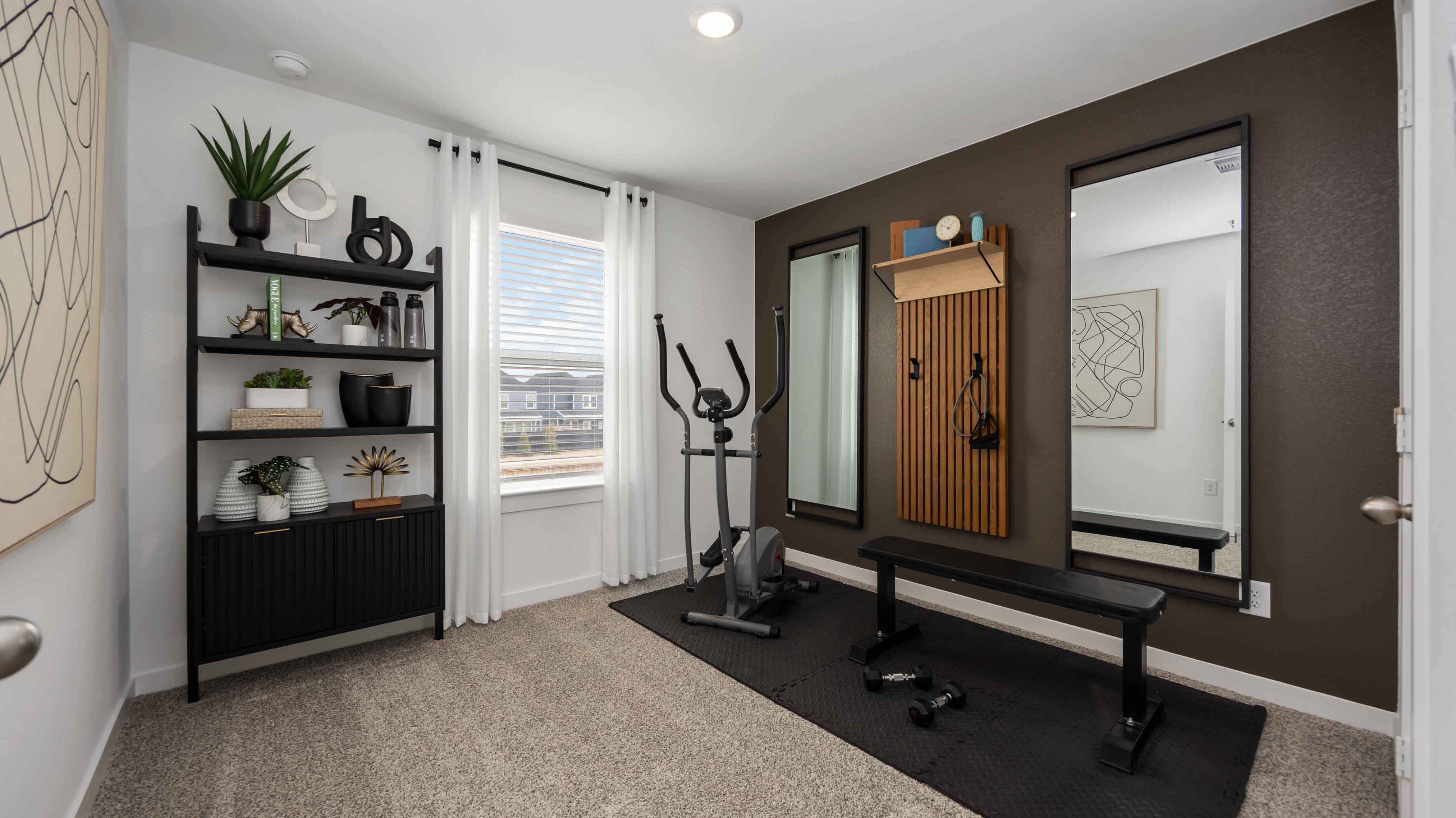 home office/third bedroom has light neutral walls and carpet flooring