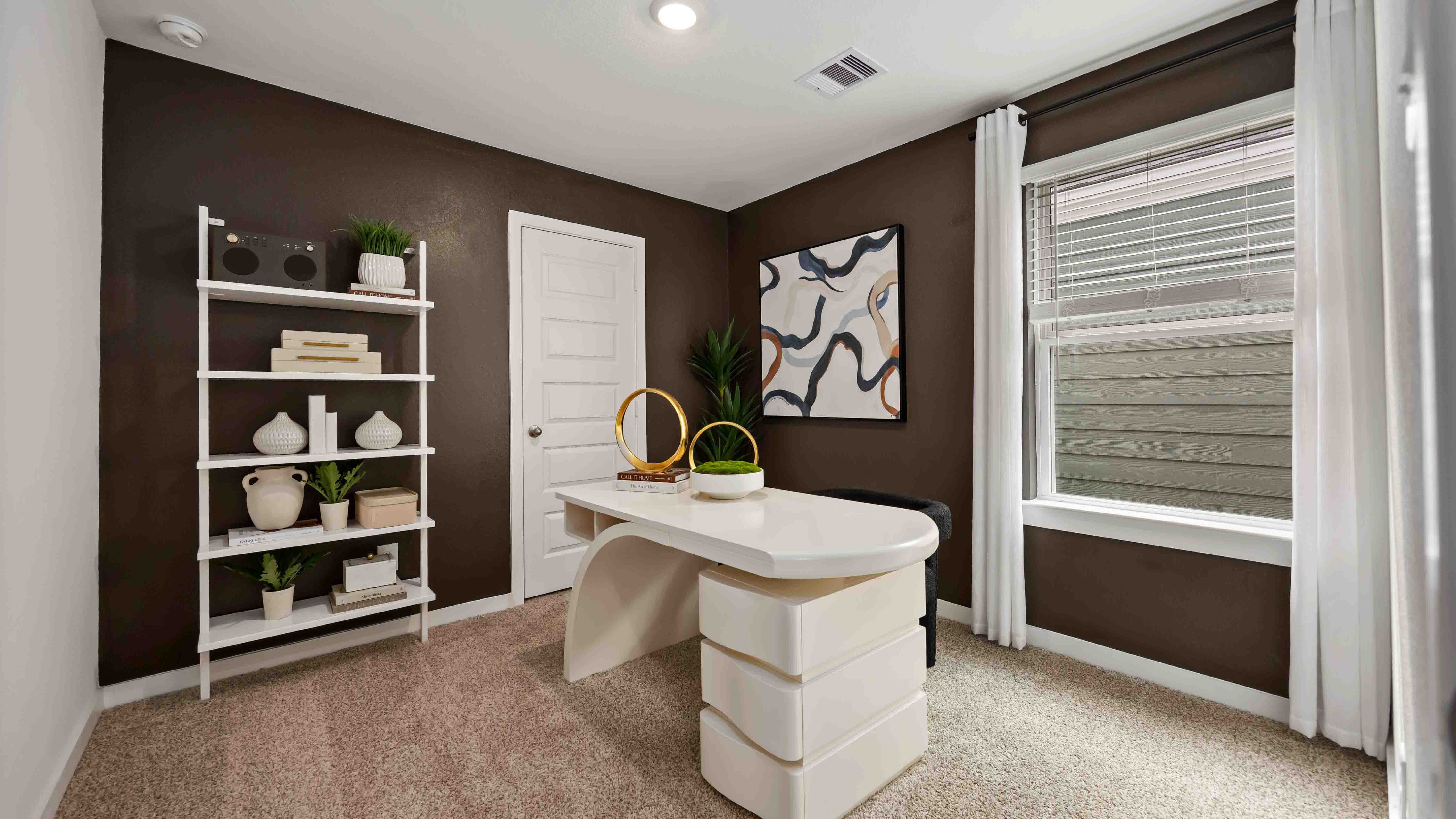 a third bedroom, shown as a home office, is also located upstairs