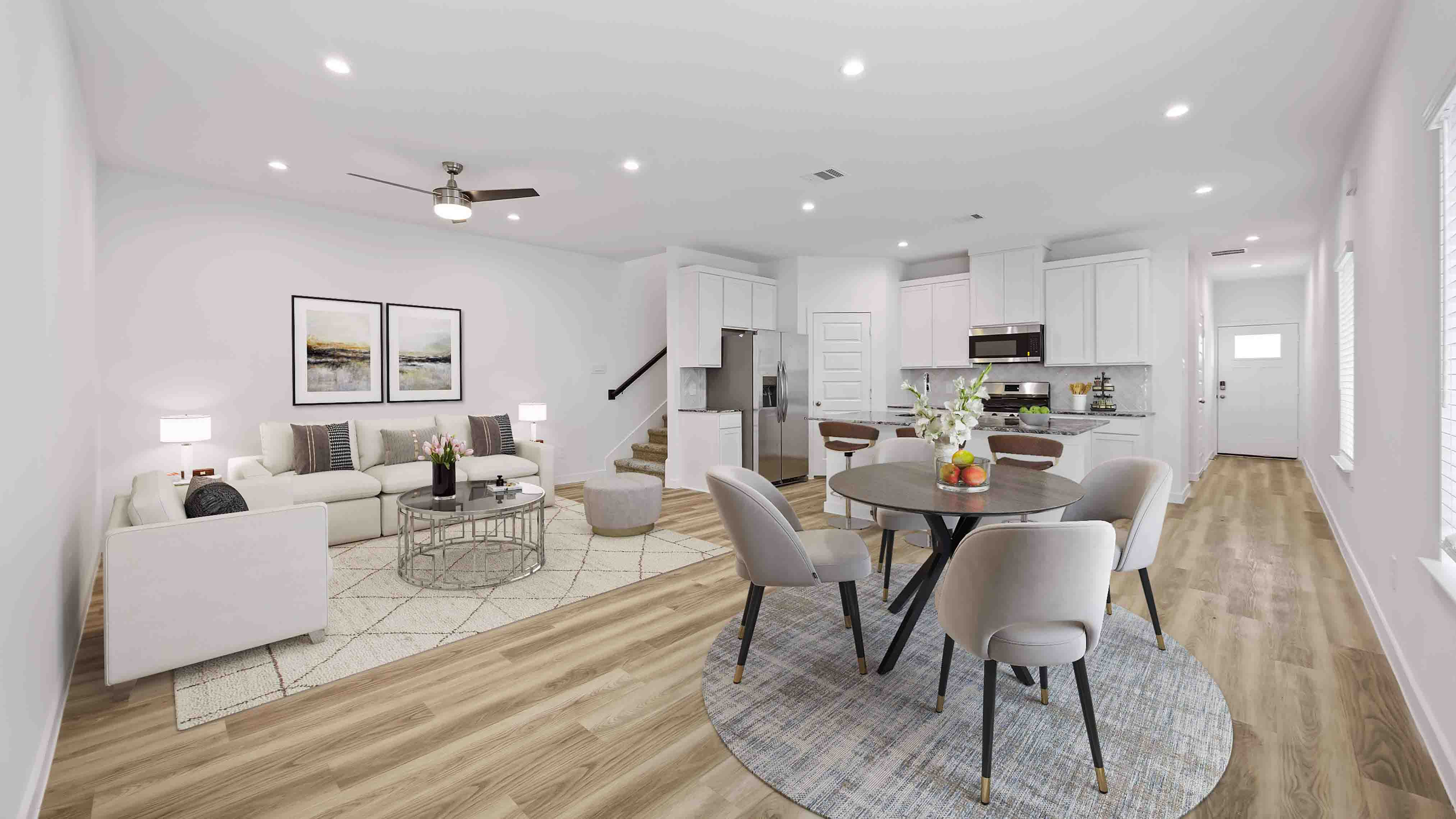 spacious living room with plenty of natural light from windows overlooking the backyard