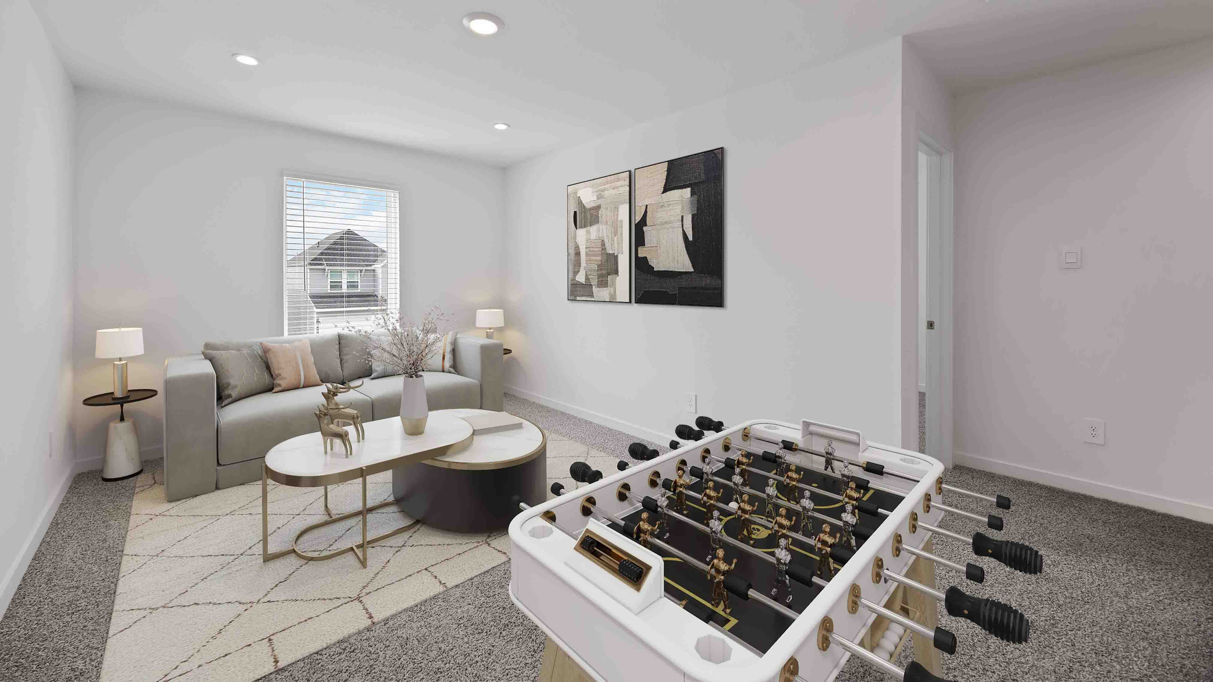 spacious upstairs living area with plenty of natural light from windows overlooking side of the home