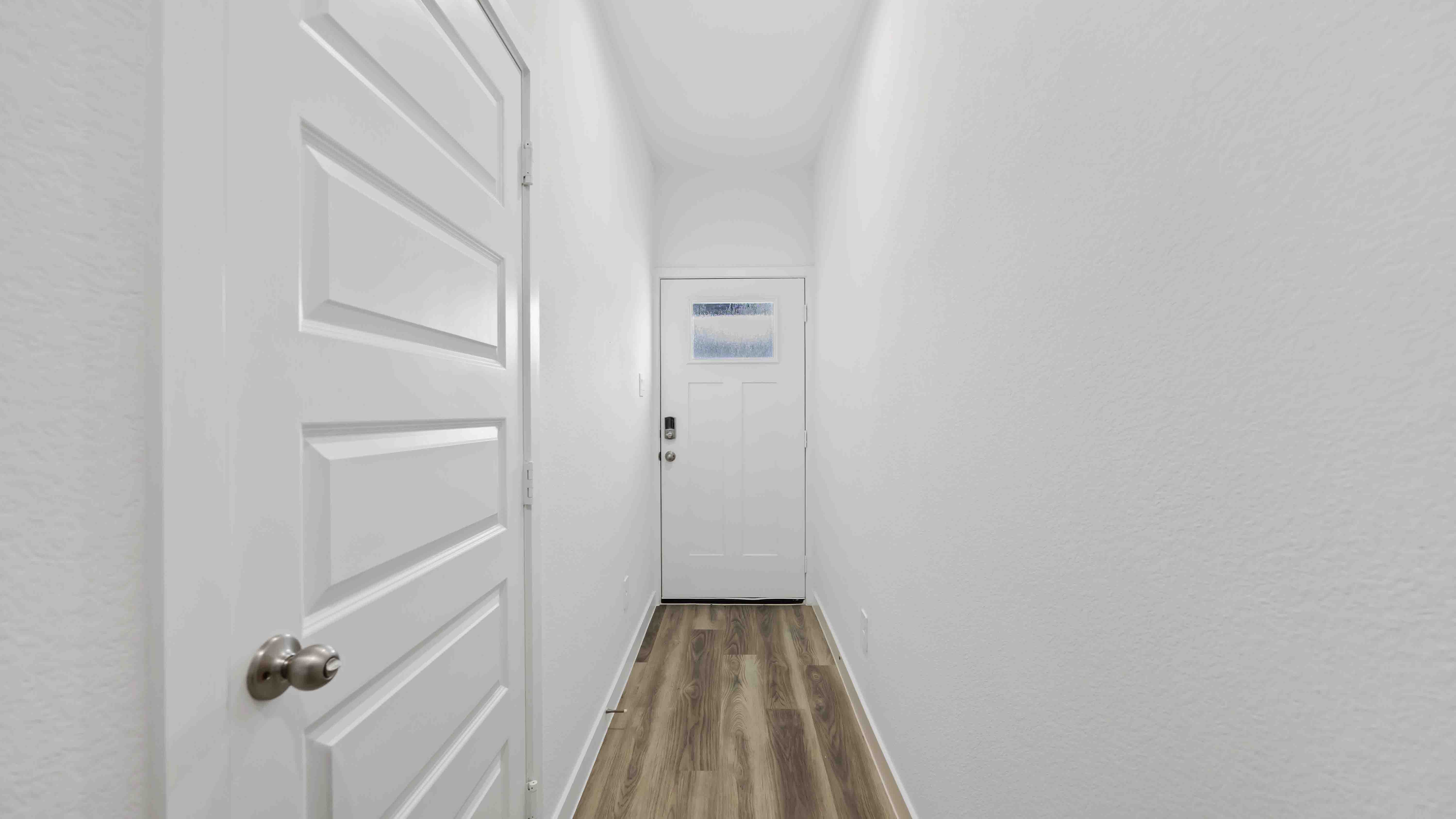 front entry way with door to garage