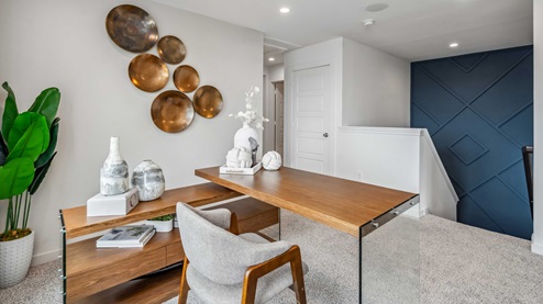 upstairs loft has carpet flooring and light neutral walls