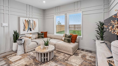 spacious living room has ample natural light from large windows