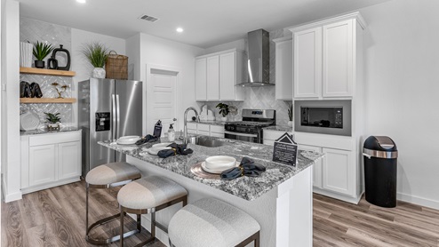 Kitchen area with an island for additional storage and seating space.