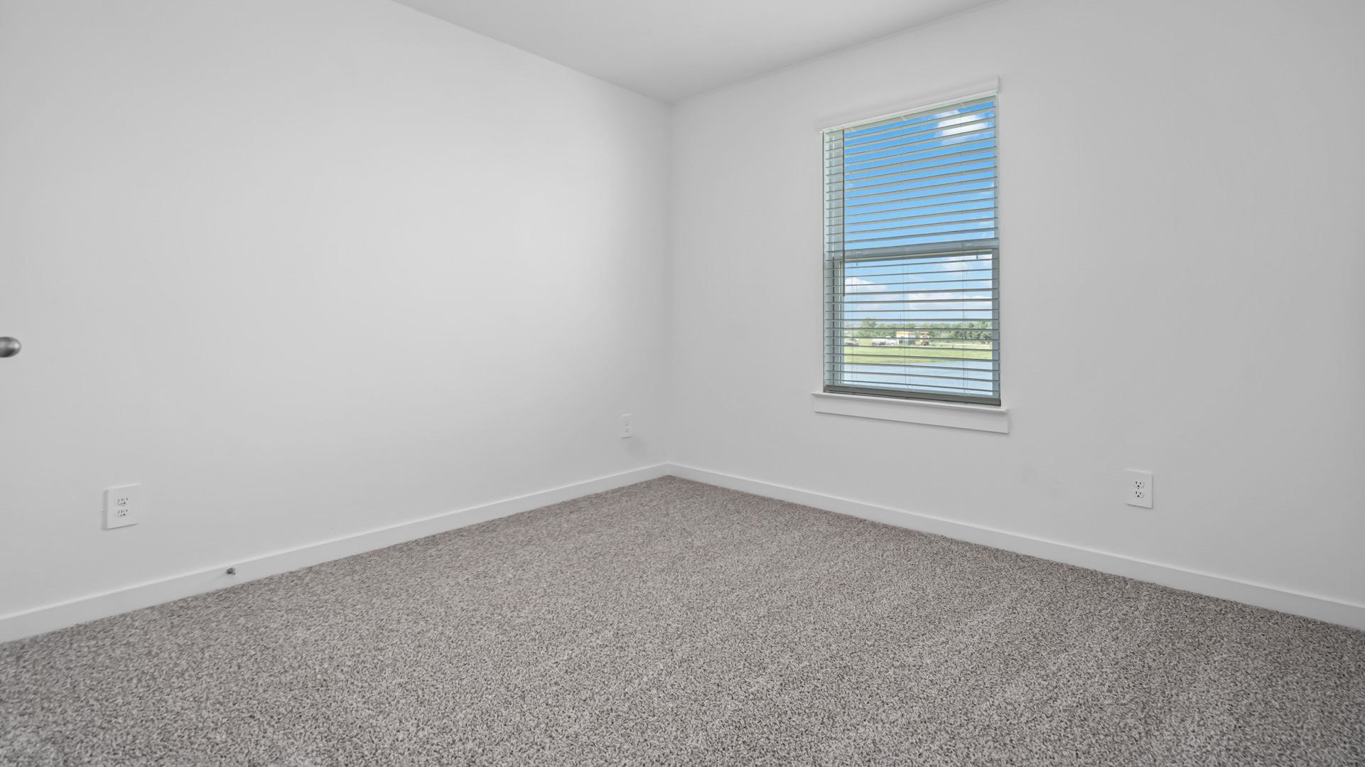 third bedroom with large single window for natural light