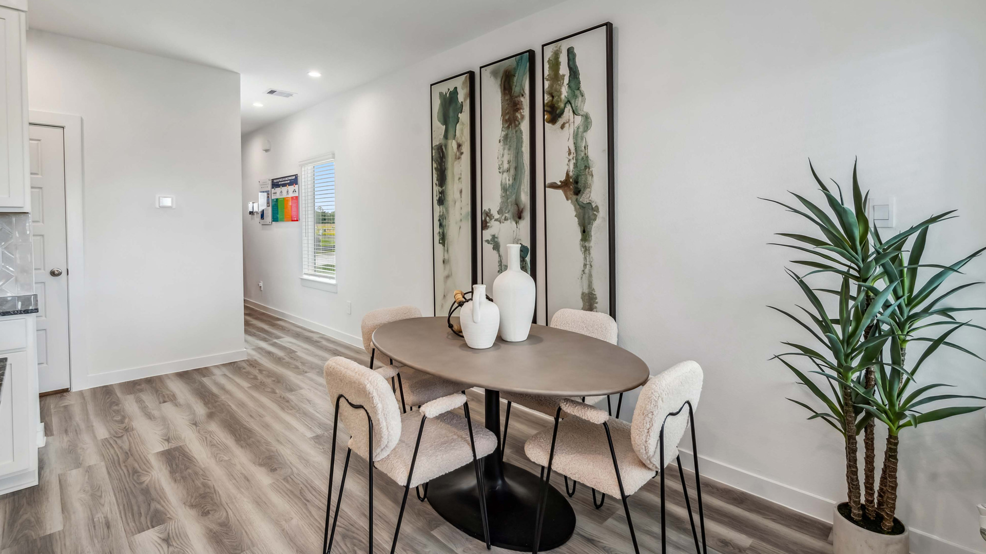 dining area is located at the end of the long entry hall