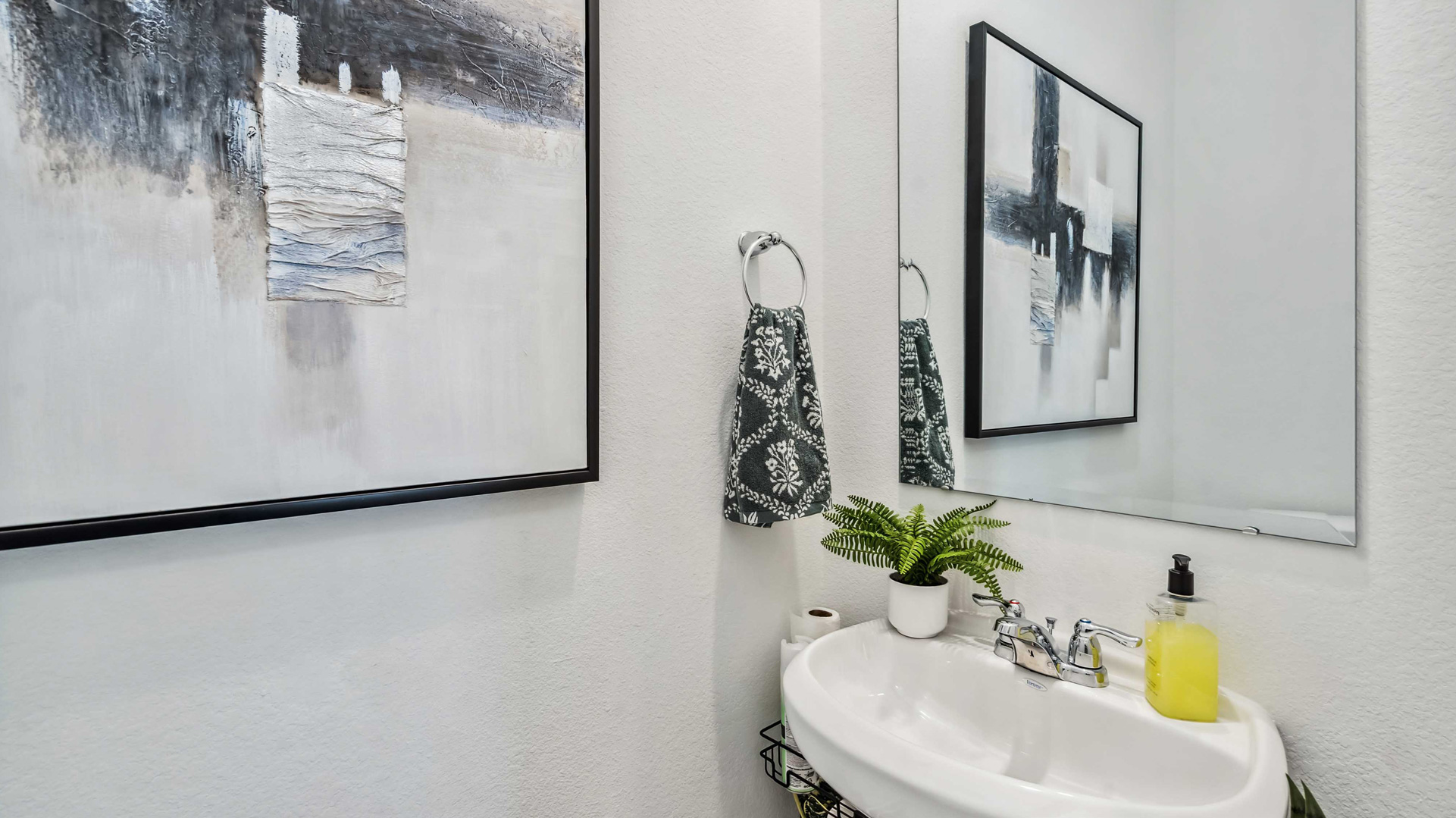 a half bath is located downstairs for convenience