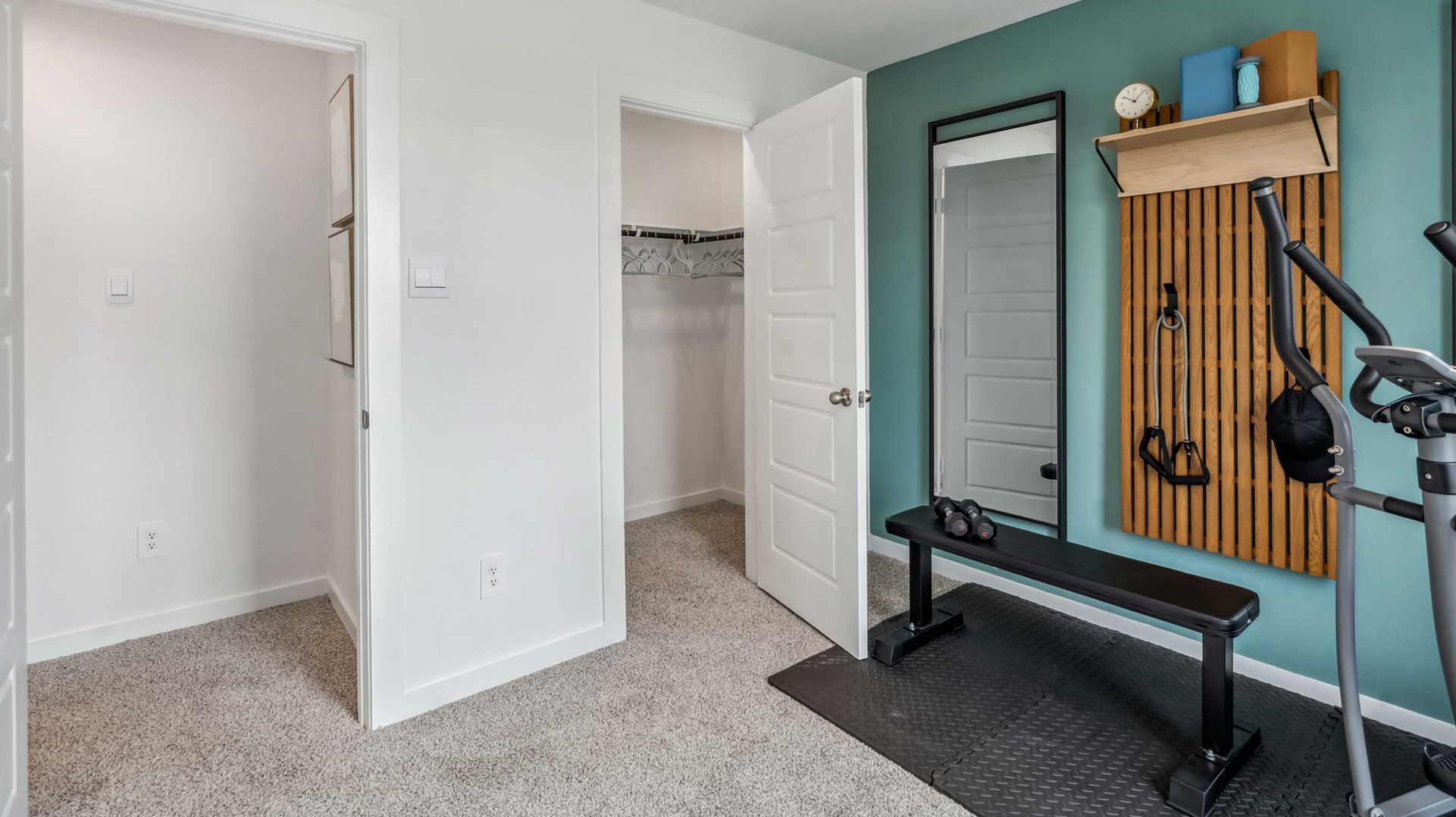 third bedroom has a walk-in closet and carpet flooring for comfort
